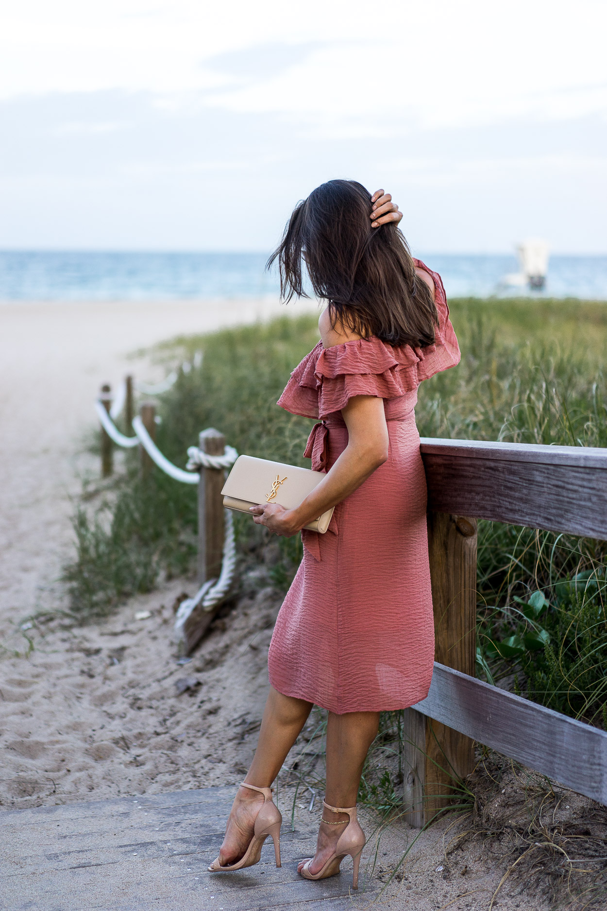 A Glam Lifestyle blogger Amanda shows her easy Summer style in a Chicwish ruffled mauve dress and carries YSL clutch