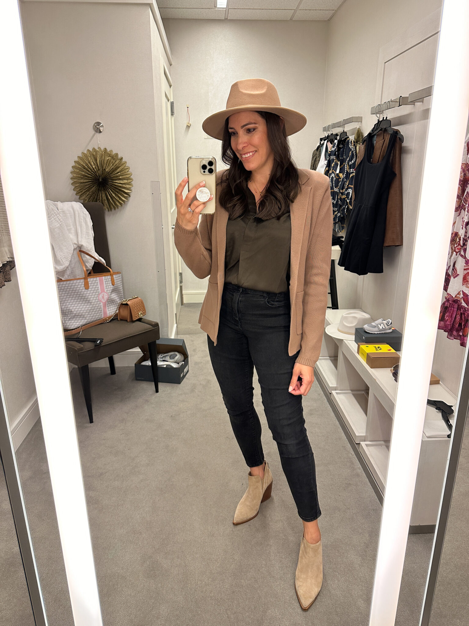 Amanda Champion wearing knit blazer, silk shirt, and skinny jeans